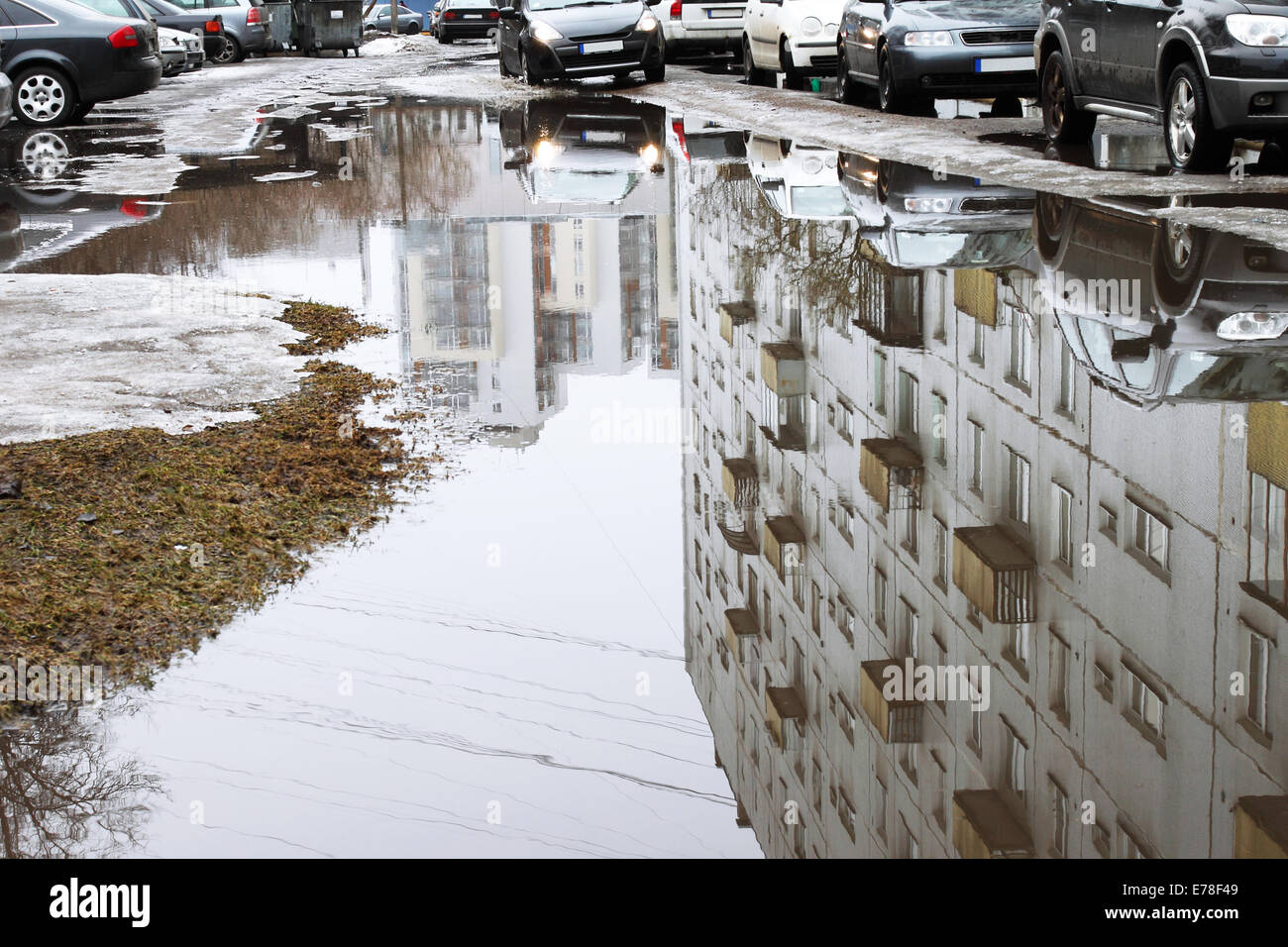 Reflections in big spring city puddle Stock Photo