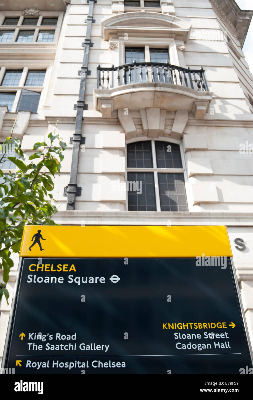 pillar signpost in sloane square, chelsea, london, giving directions to nearby places of