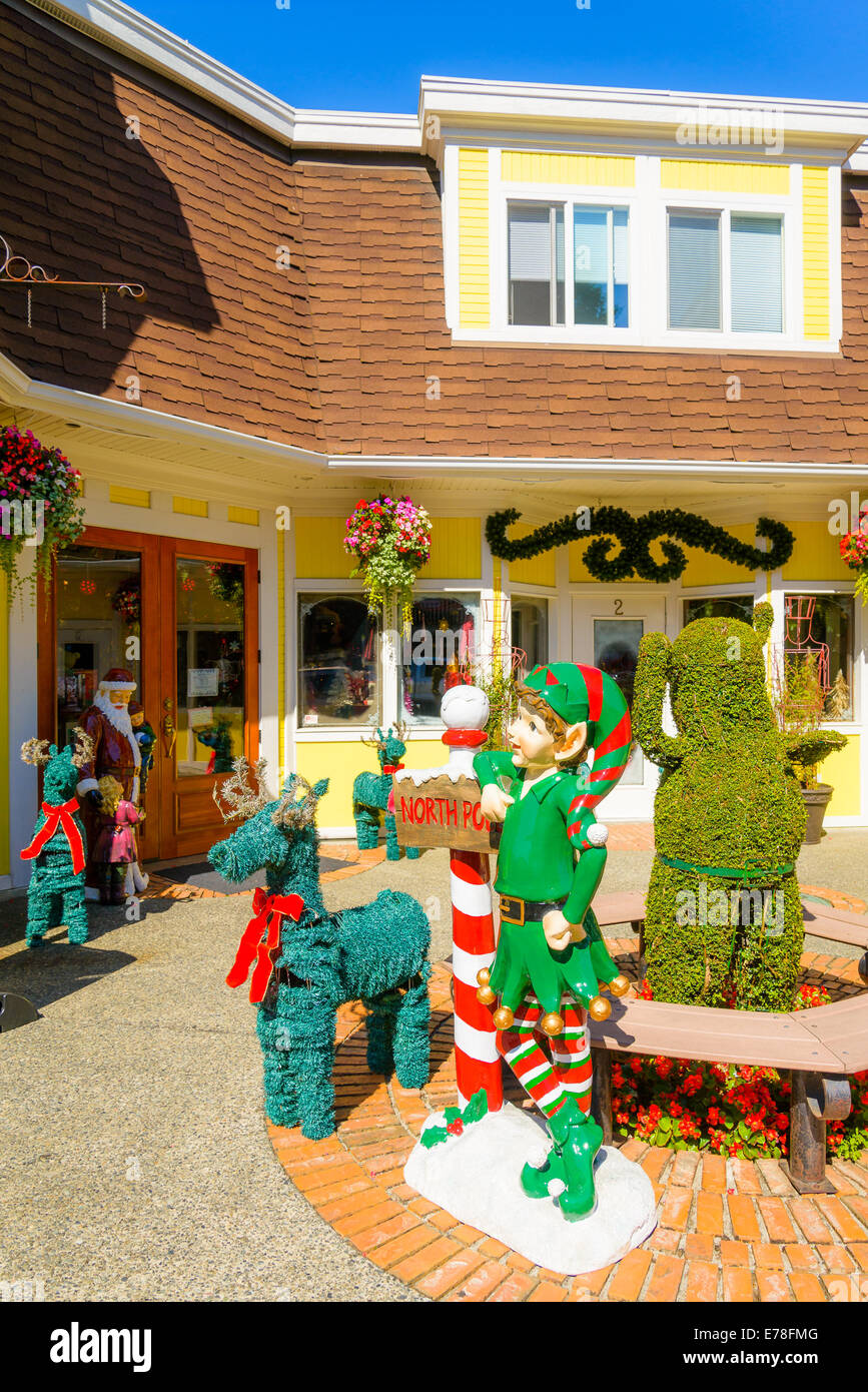 Christmas elf and reindeer outside Christmas store, Chemainus, British Columbia, Canada Stock Photo