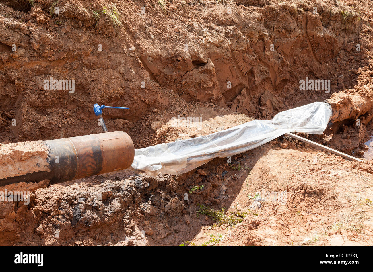 Repair of the underground pipeline in trench Stock Photo Alamy