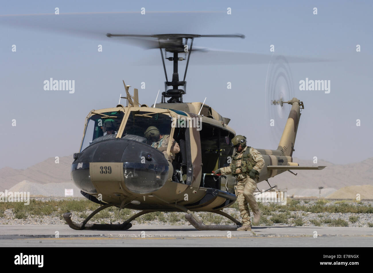Bell Huey II on the ramp at Kandahar Airfield Stock Photo