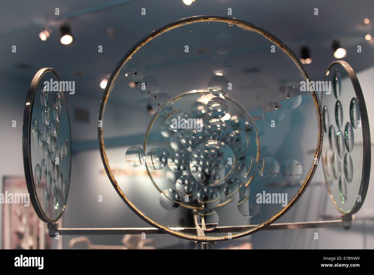 Glass circles on display in art gallery Stock Photo