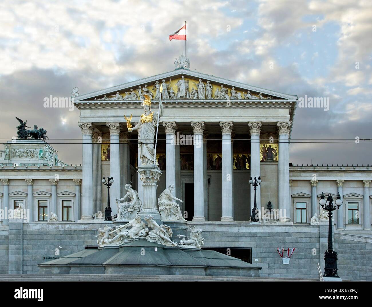 Detail of the facade of the austrian House of Parliament, with the statue of Athena-Pallas in front, Vienna, Austria. Stock Photo