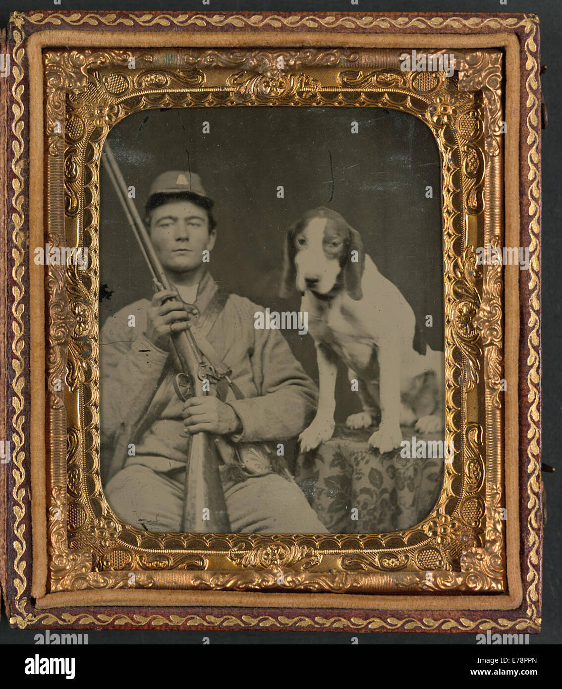 [Unidentified soldier in Confederate uniform with shotgun sitting Stock Photo