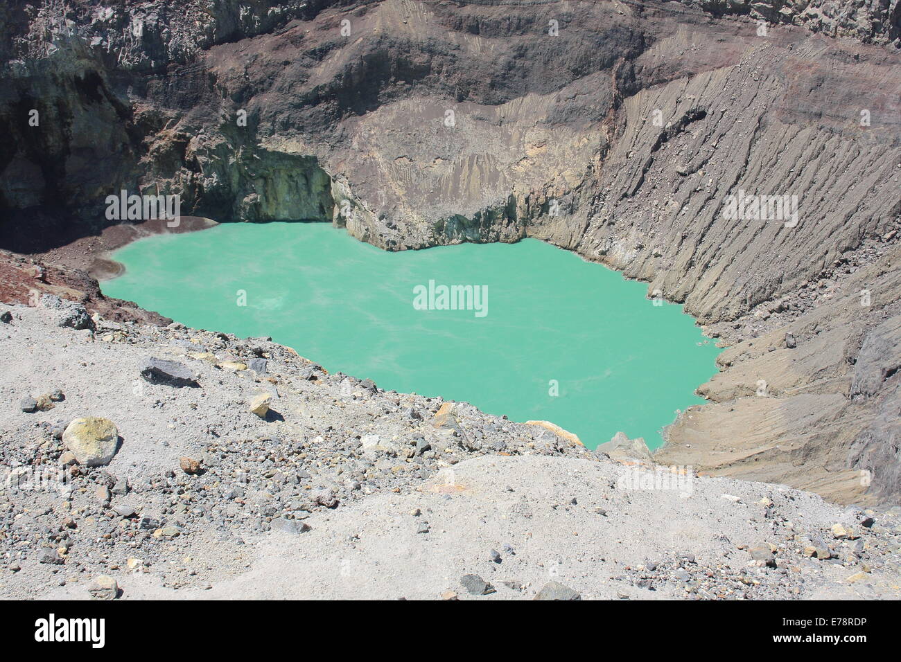 The blue-green lake in the crater of Santa Ana (Ilamatepec) volcano, El Salvador, bubbles slowly due to the geothermal heat. Stock Photo