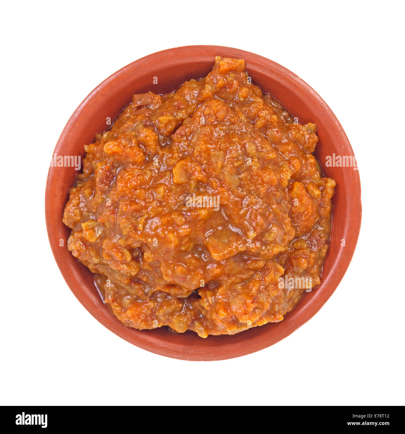 Top view of hot dog chili used as a condiment in a bowl on a white background. Stock Photo