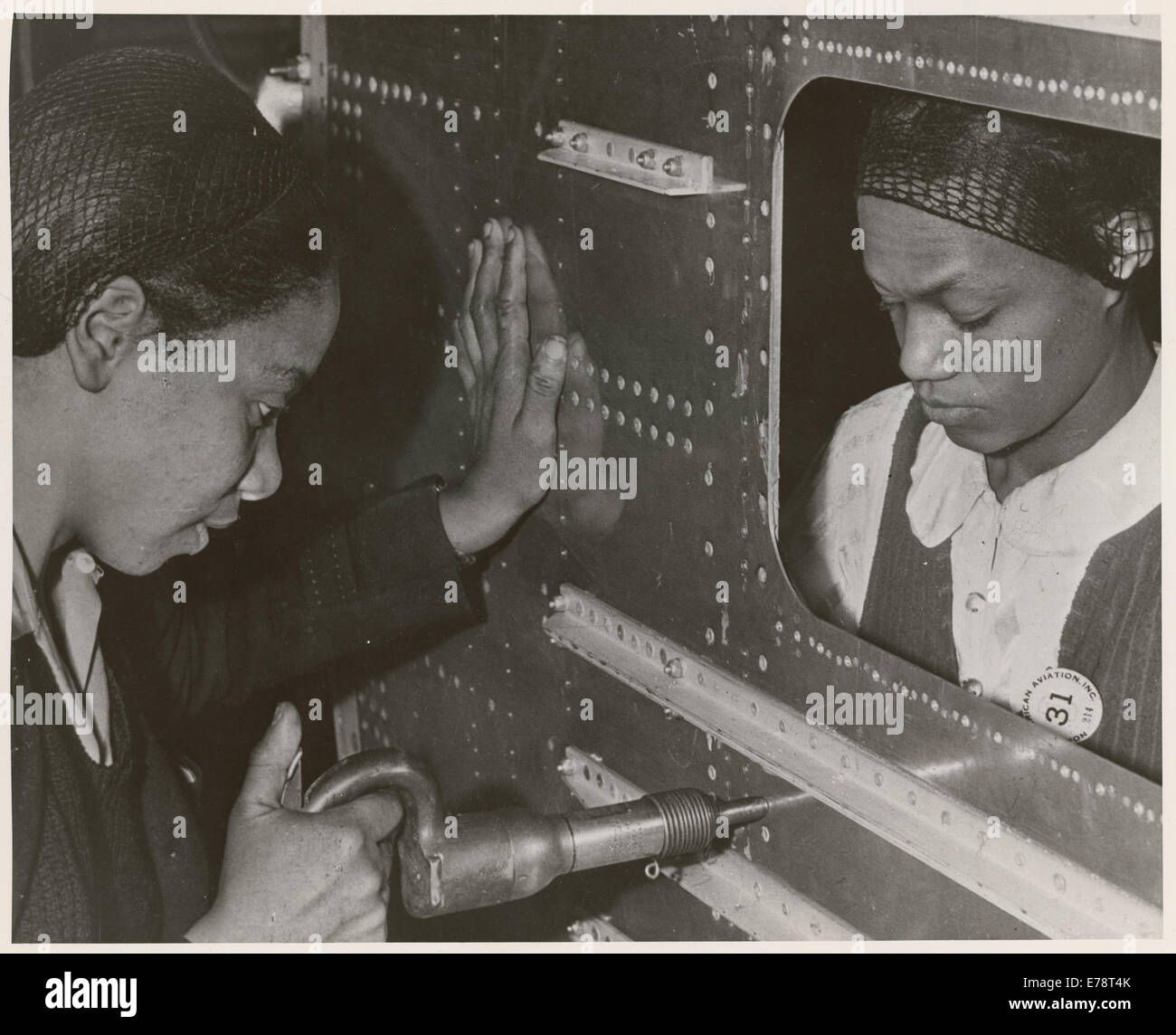 Evelyn T. Gray, Riveter and Pearlyne Smiley, Bucker, Complete a Job on Center Section of a Bomber  From: Women Working In Indust Stock Photo