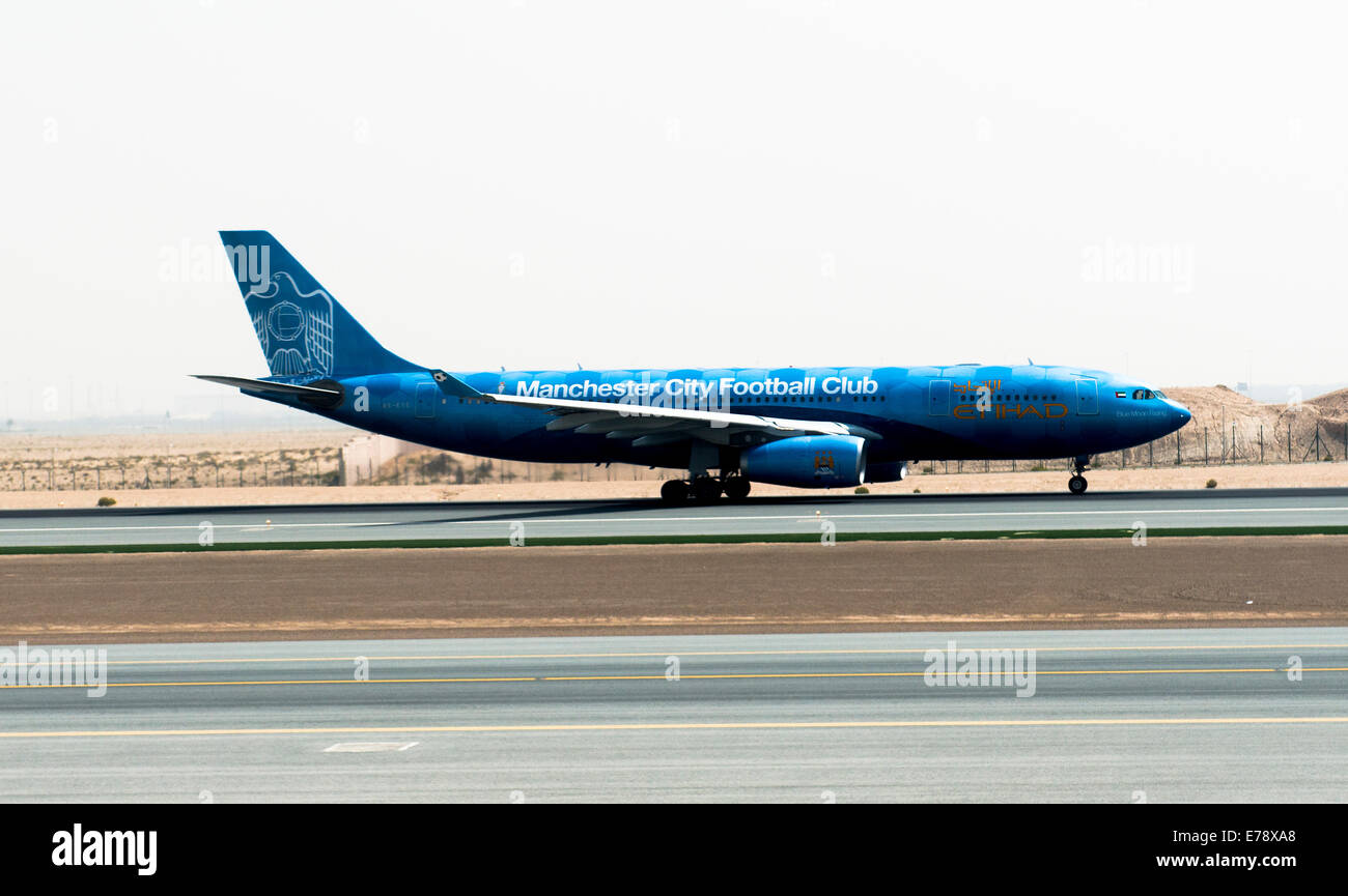 Pakistan International airplane landing in Abu Dhabi international airport. Stock Photo