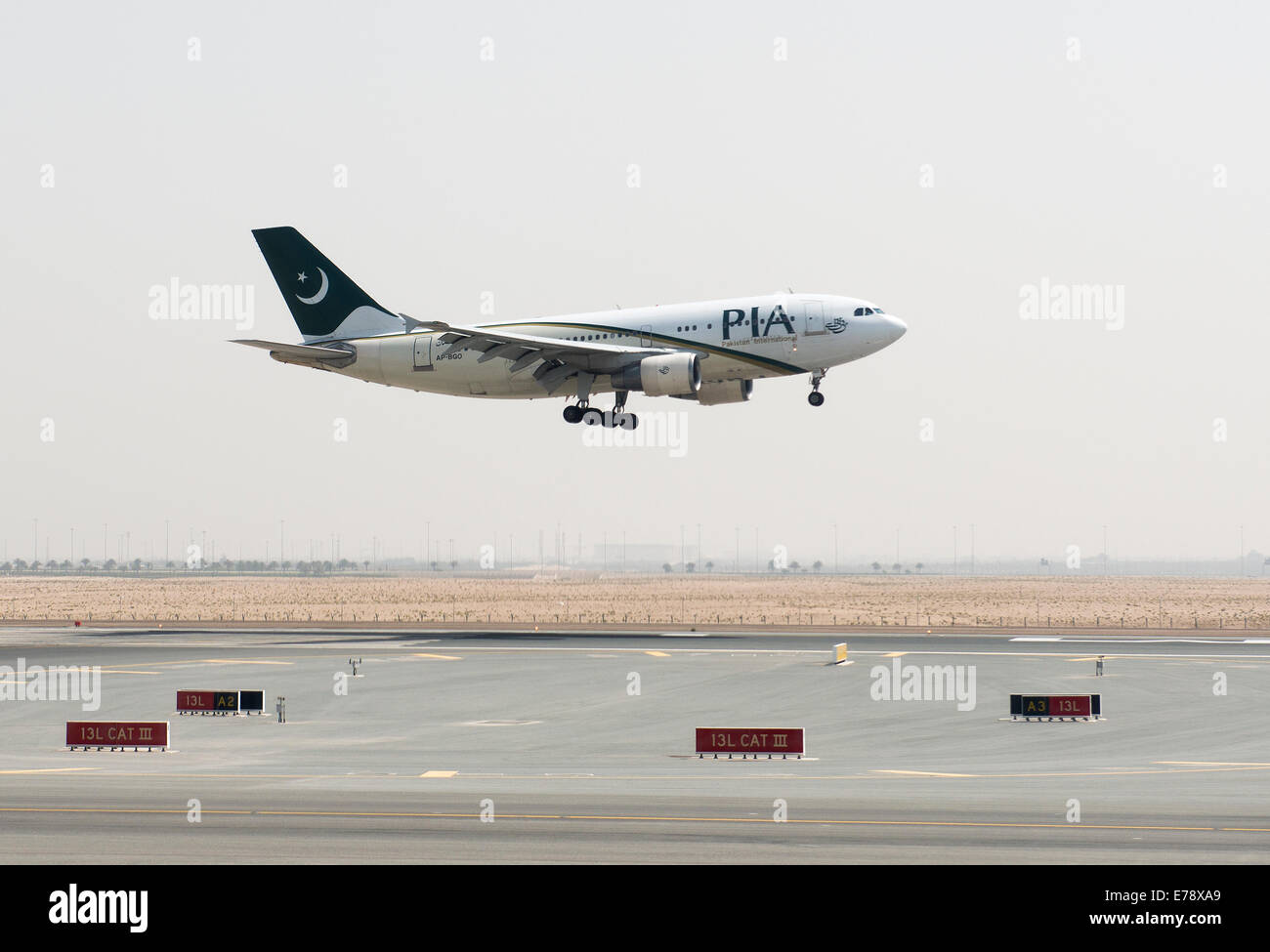 Pakistan International airplane landing in Abu Dhabi international airport. Stock Photo