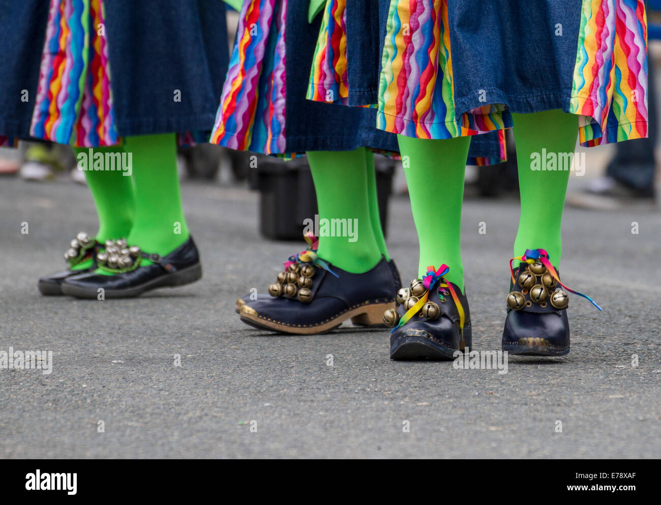 Green tights and black shoes with bells folk dancing at Swanage, Purbeck, Dorset, UK Stock Photo