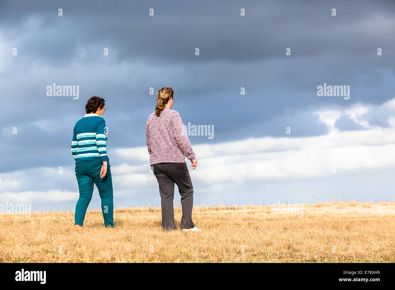 Women mother daughter walking expressions countryside landscape with