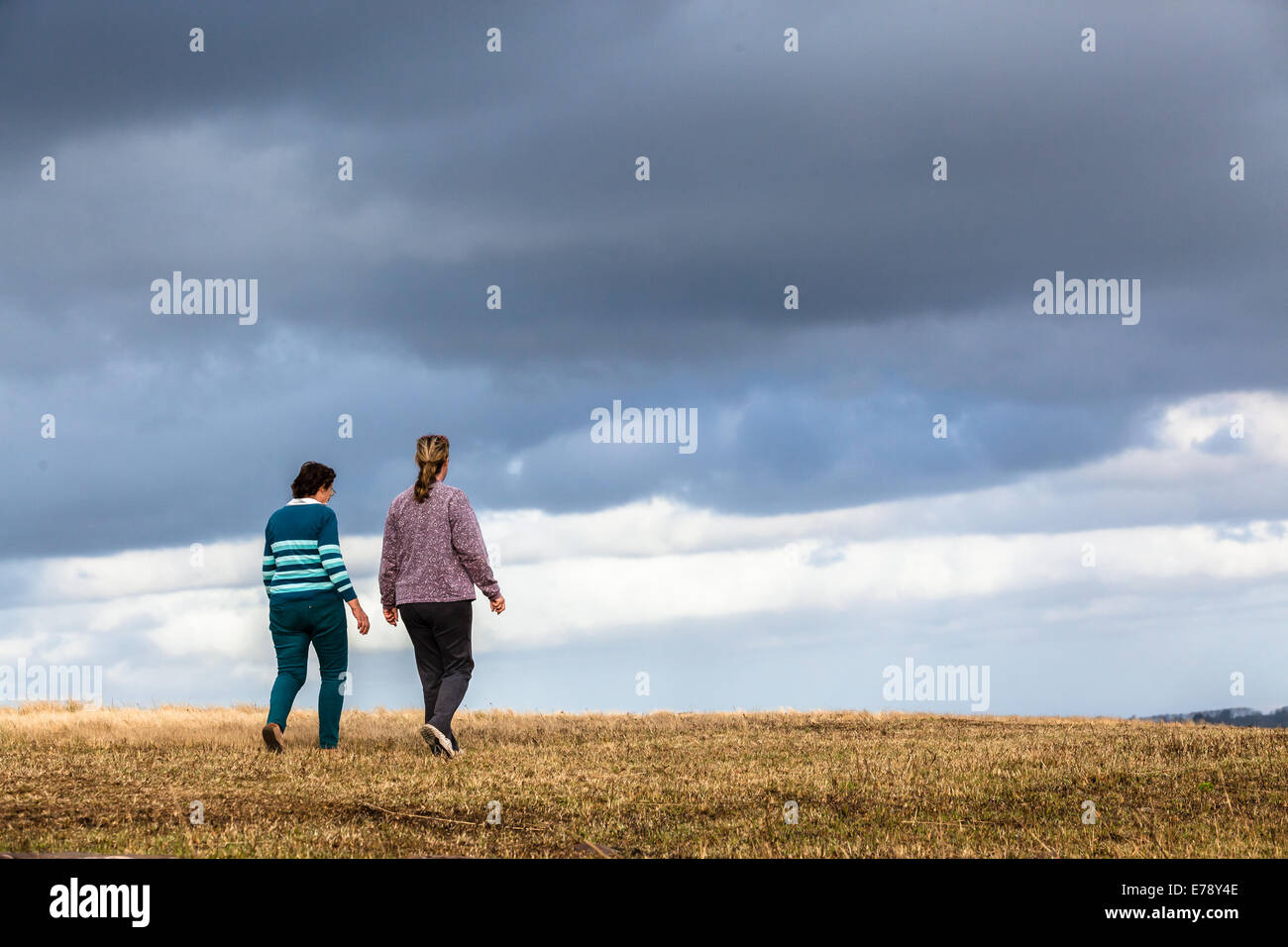 Women mother daughter walking expressions countryside landscape with