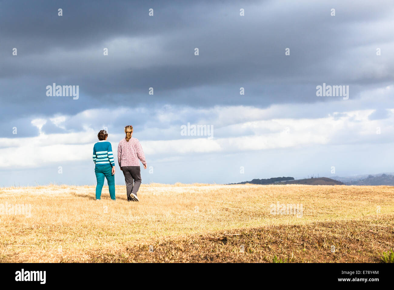 Women mother daughter walking expressions countryside landscape with