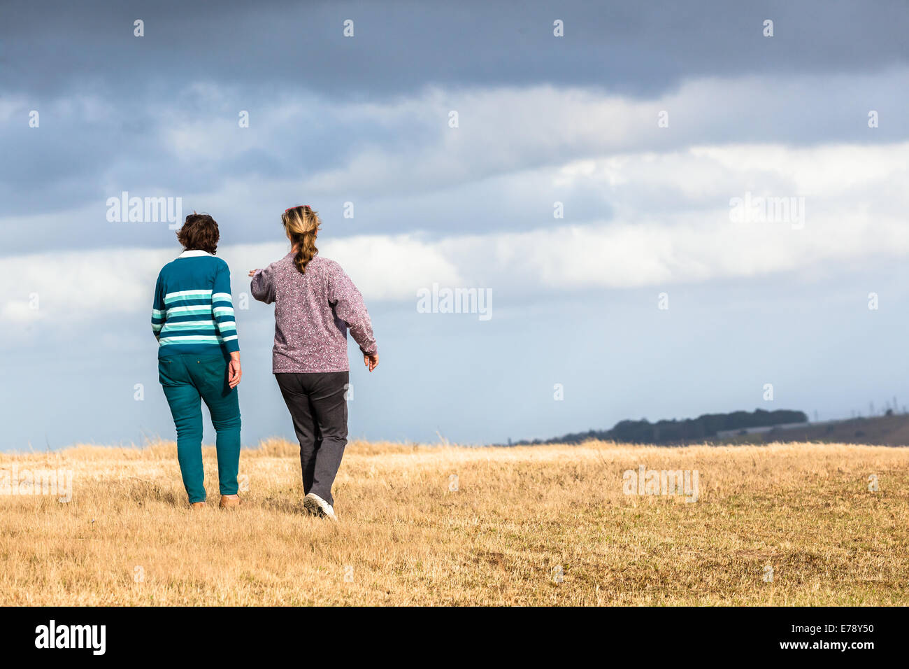 Women mother daughter walking expressions countryside landscape with