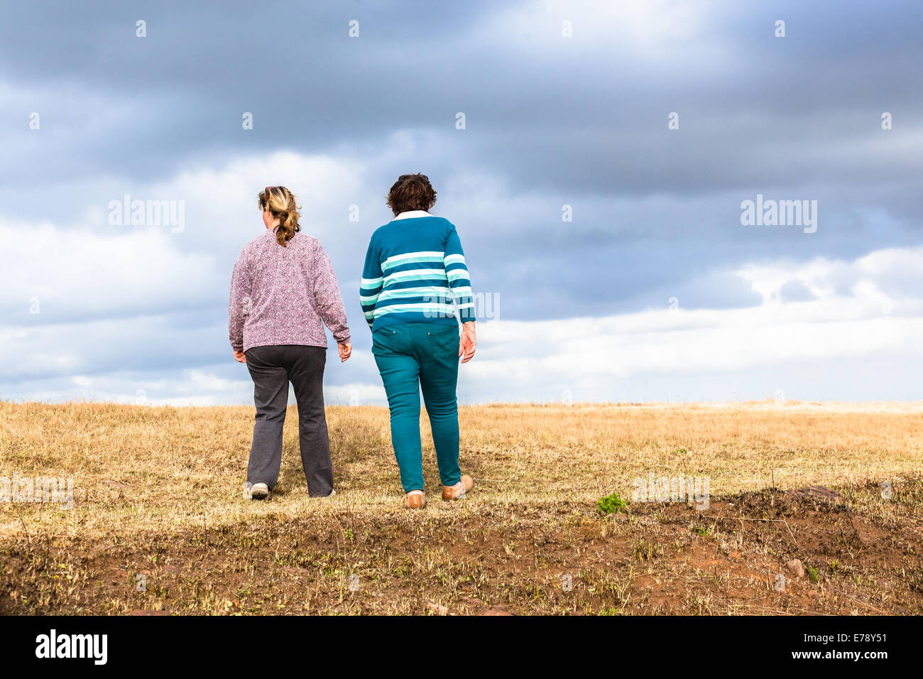 Women mother daughter walking expressions countryside landscape with