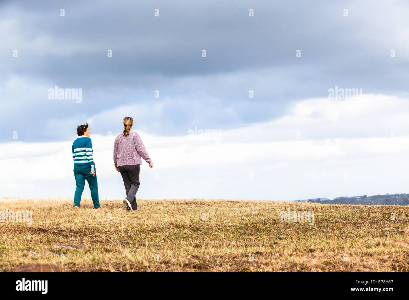 Women mother daughter walking expressions countryside landscape with