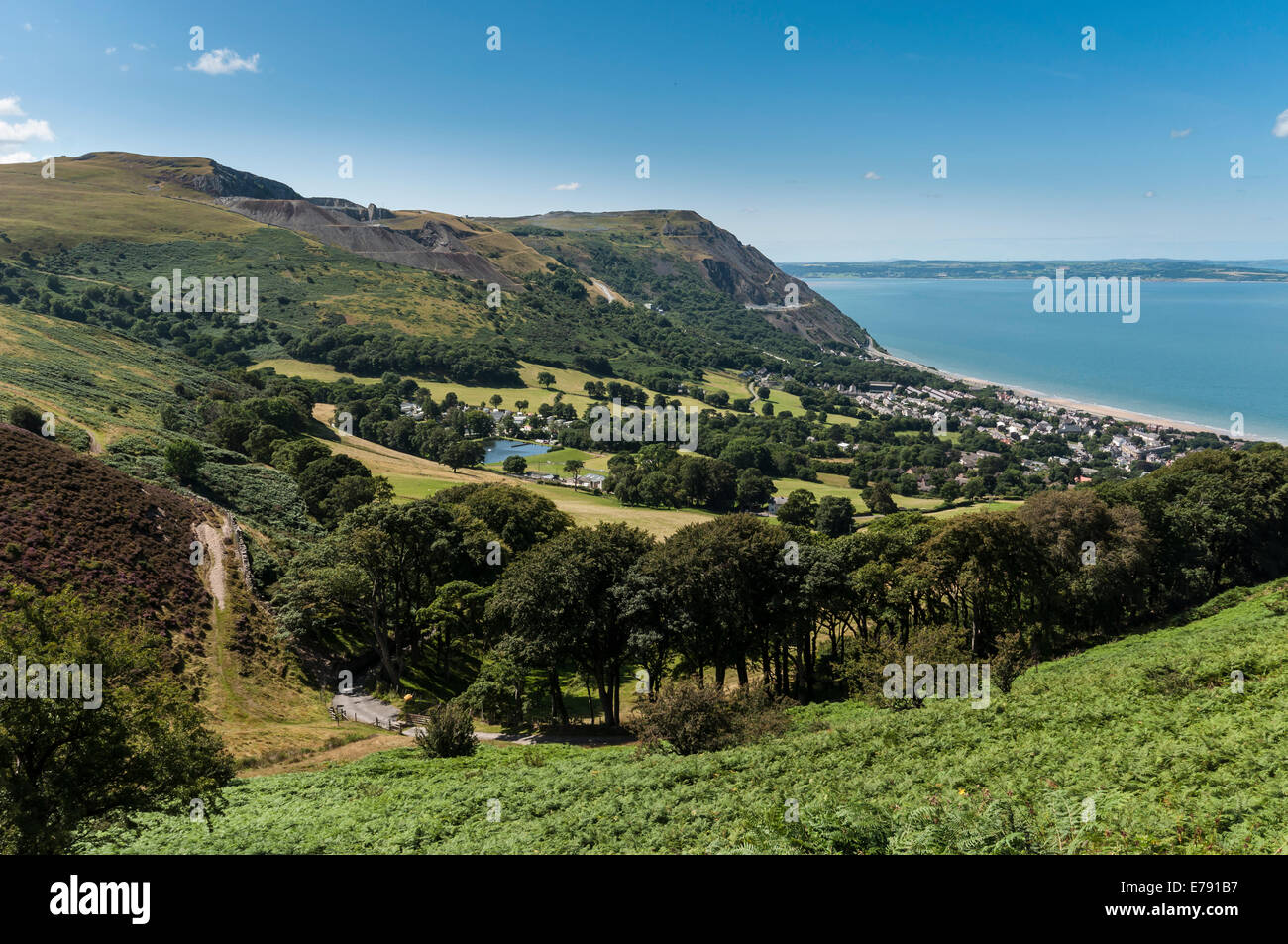 Jubilee Path on Foel Lus above Penmaenmawr North Wales coast looking towards Anglesey with Graiglwyd in the valley Stock Photo