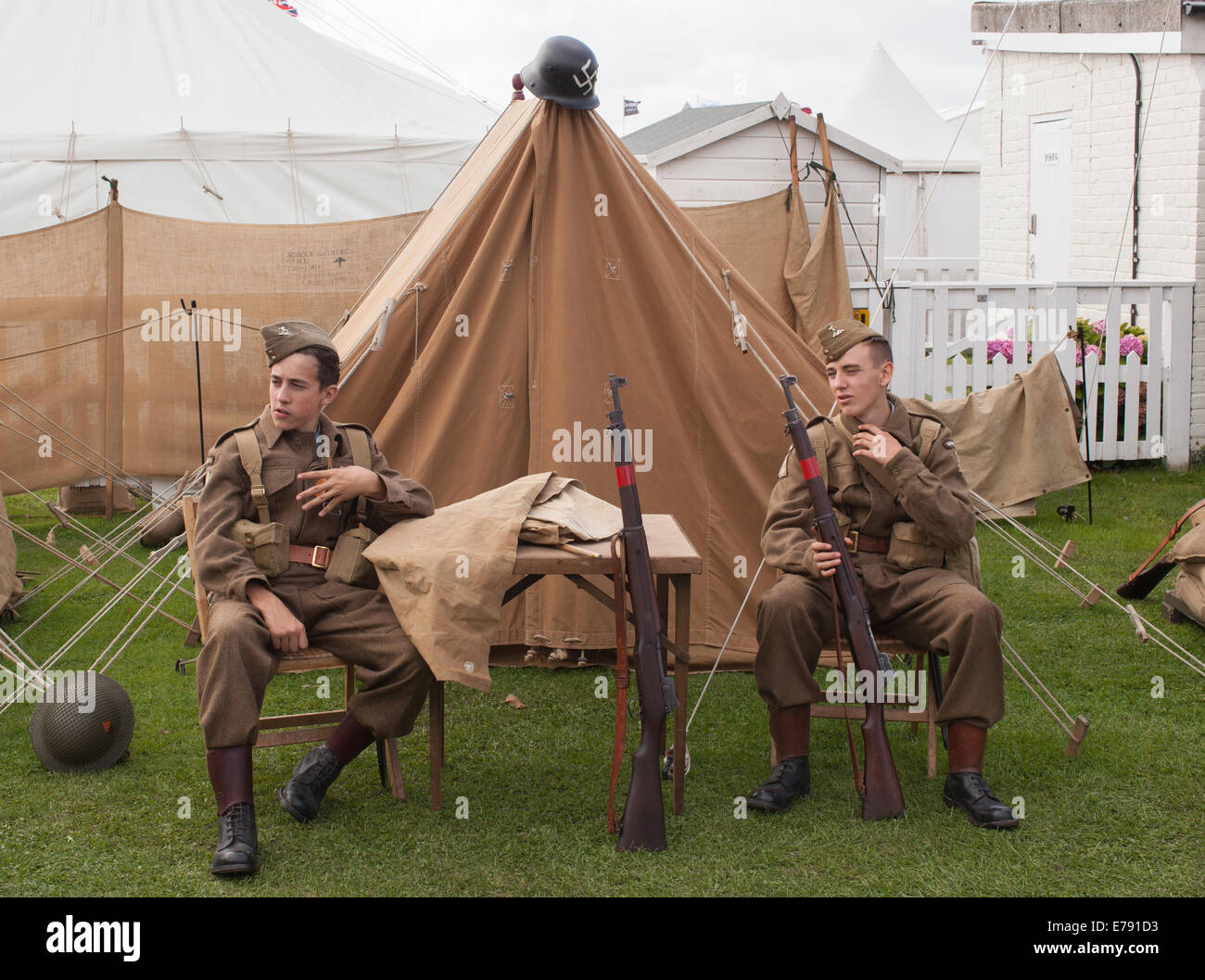 Home guards outside tent Stock Photo