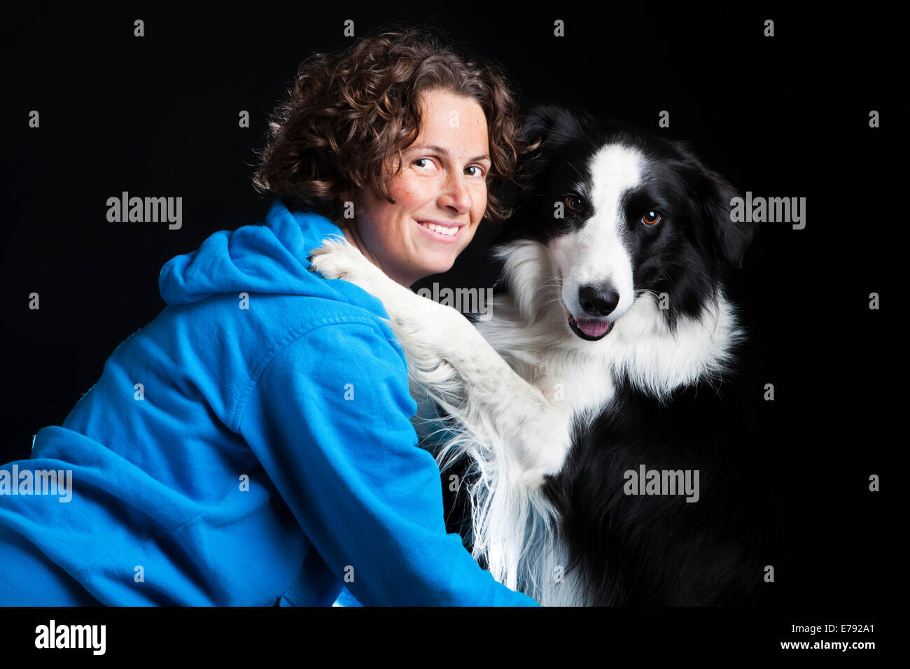 Young woman with a Border Collie, black and white Stock Photo
