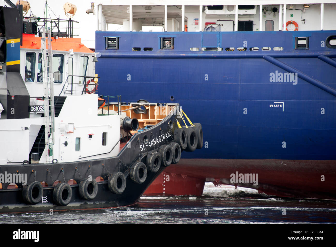 Tug Boat Moving Large Container Ship Dock Docking Stock Photo Alamy