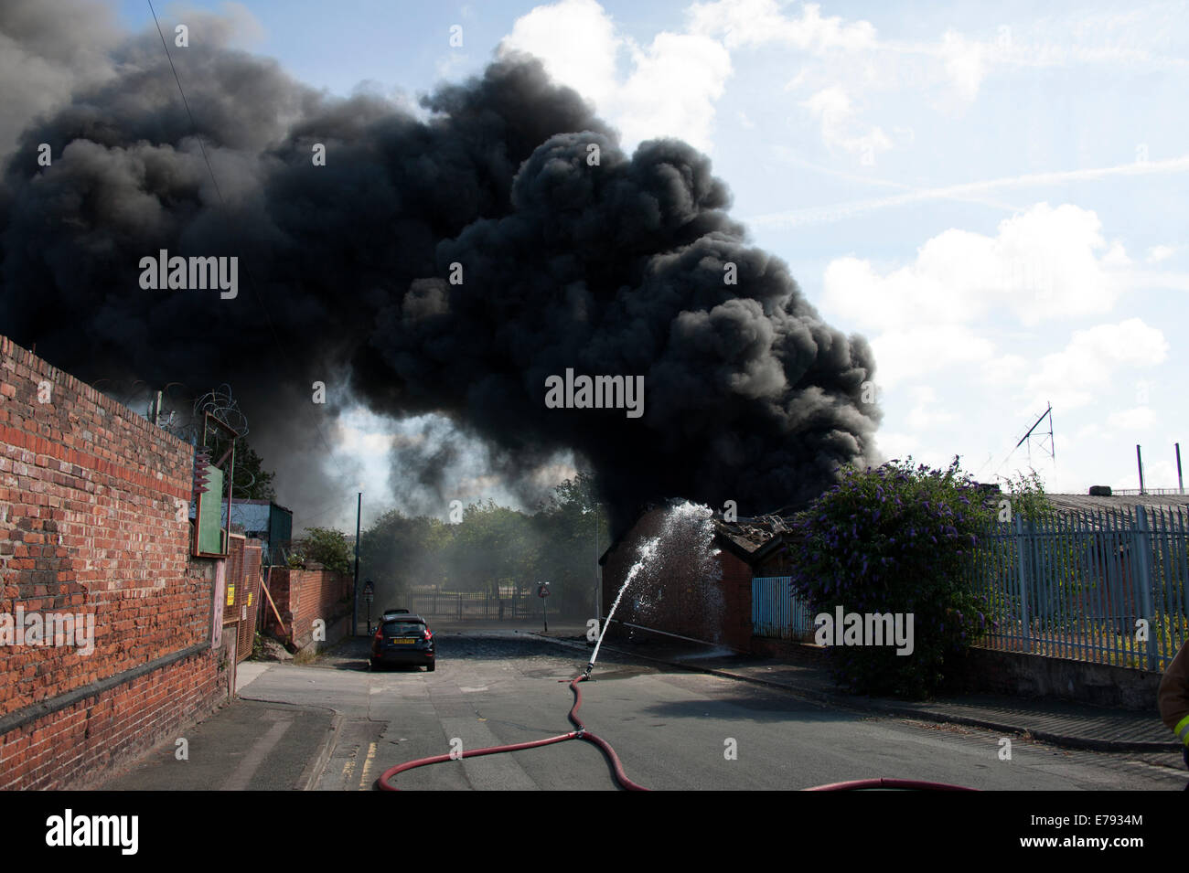 Thick Black Smoke Pollution Carbon Fire Hose Water Stock Photo
