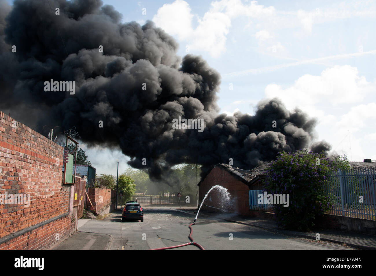 Thick Black Smoke Pollution Carbon Fire Hose Water Stock Photo