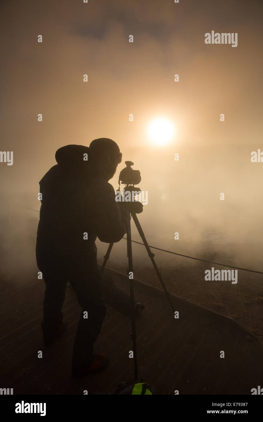 the workshop group shooting at Geysir at dawn, Iceland Stock Photo