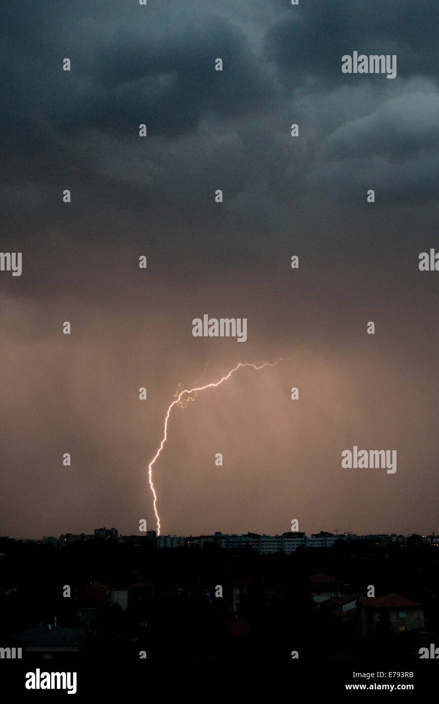 lightning bolt in night sky over the horizon Stock Photo