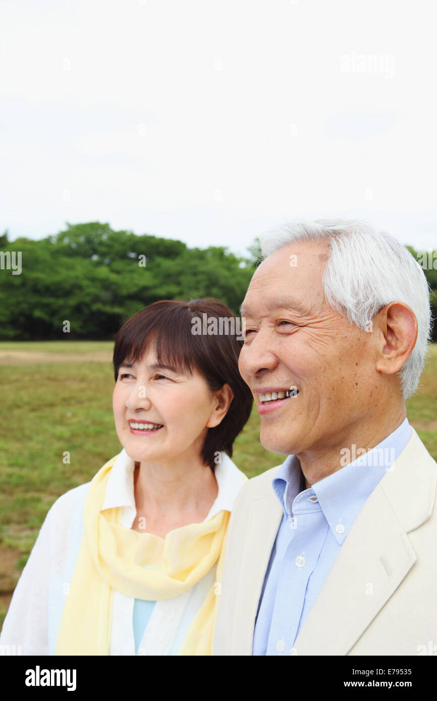 Senior adult Japanese couple in a park Stock Photo - Alamy
