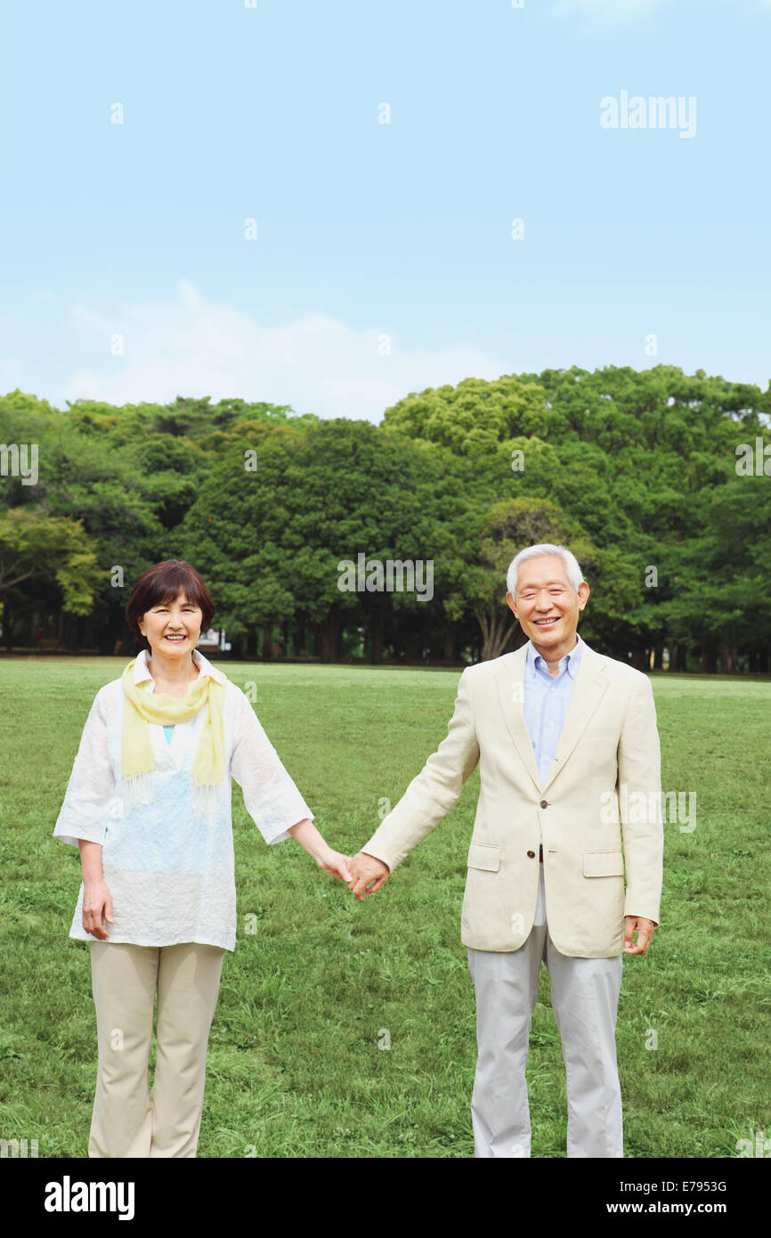 Senior adult Japanese couple in a park Stock Photo - Alamy