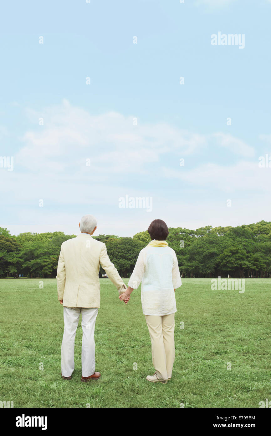 Rear view of elderly women walking in park hi-res stock photography and ...
