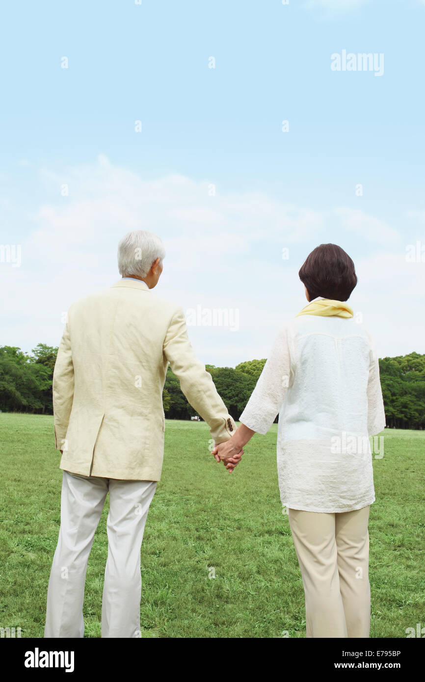 Rear view of elderly women walking in park hi-res stock photography and ...
