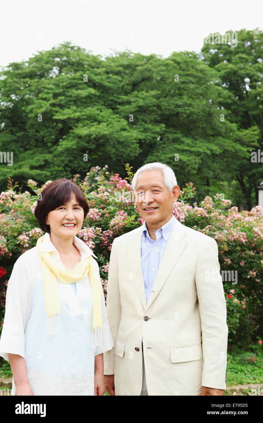 Senior adult Japanese couple in a park Stock Photo - Alamy