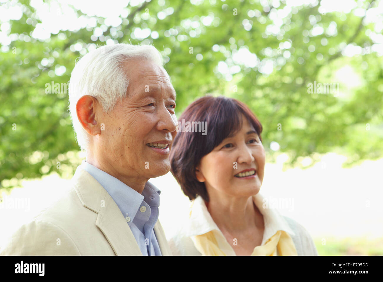 Senior adult Japanese couple in a park Stock Photo - Alamy