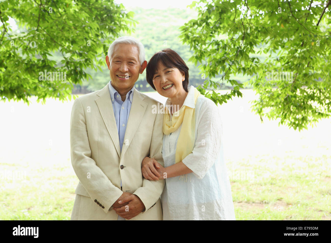 Senior adult Japanese couple in a park Stock Photo - Alamy
