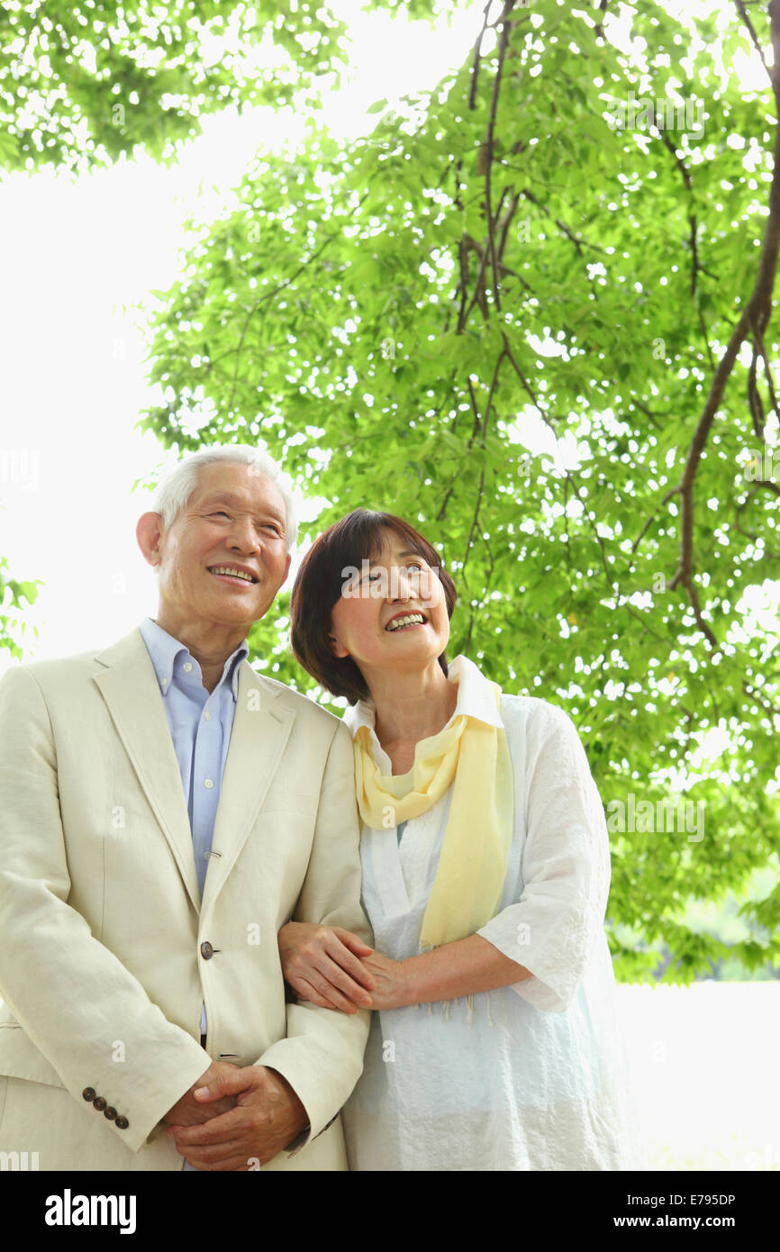 Senior adult Japanese couple in a park Stock Photo - Alamy