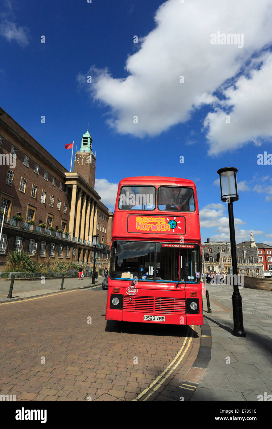 Red, double decker sightseeing bus parked outside Norwich city hall, Norfolk, England, UK. Stock Photo