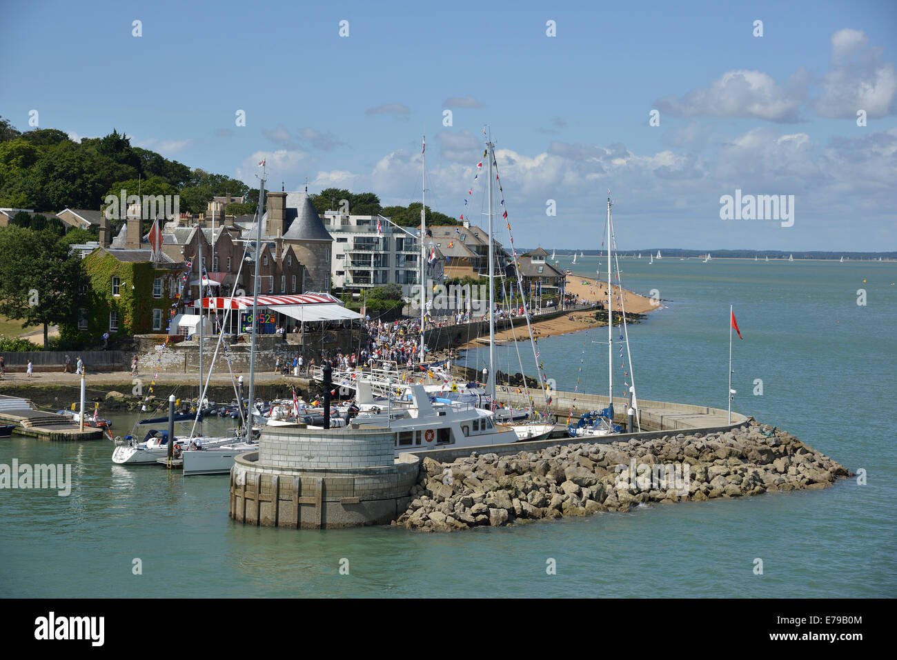 Spectators on shore and around the Royal Yacht Squadron during Cowes Week, Cowes, Isle of Wight, UK, England Stock Photo