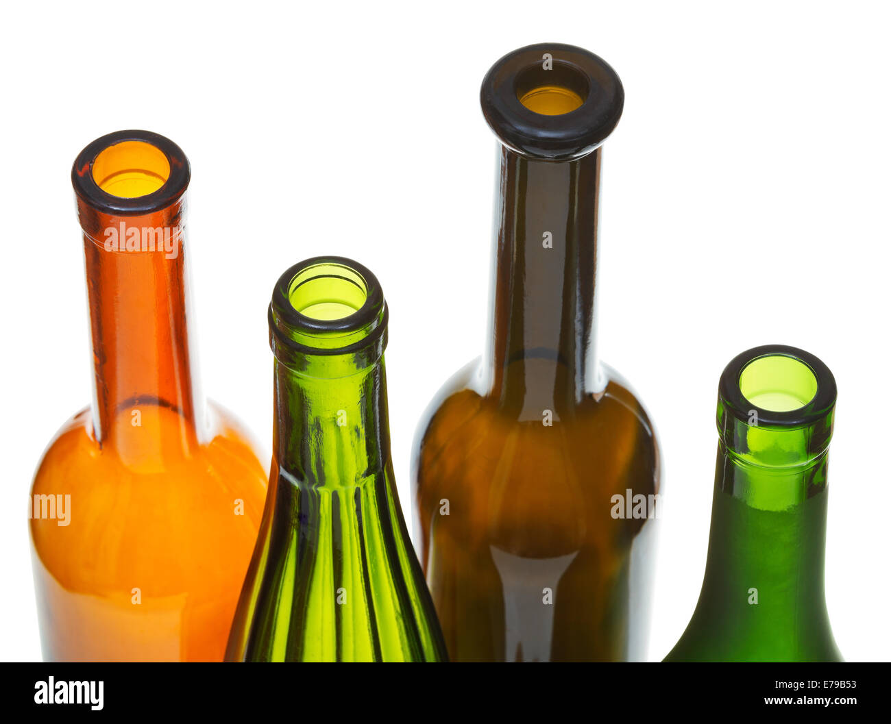 four open bottlenecks of colored wine bottles close up isolated on
