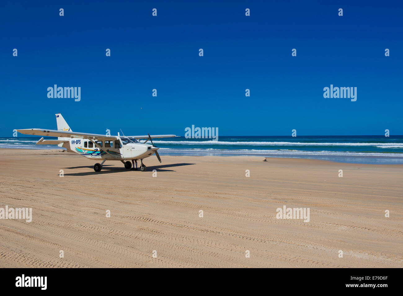 Small plane landing on the 75 Mile Beach, Fraser Island, Queensland, Australia Stock Photo