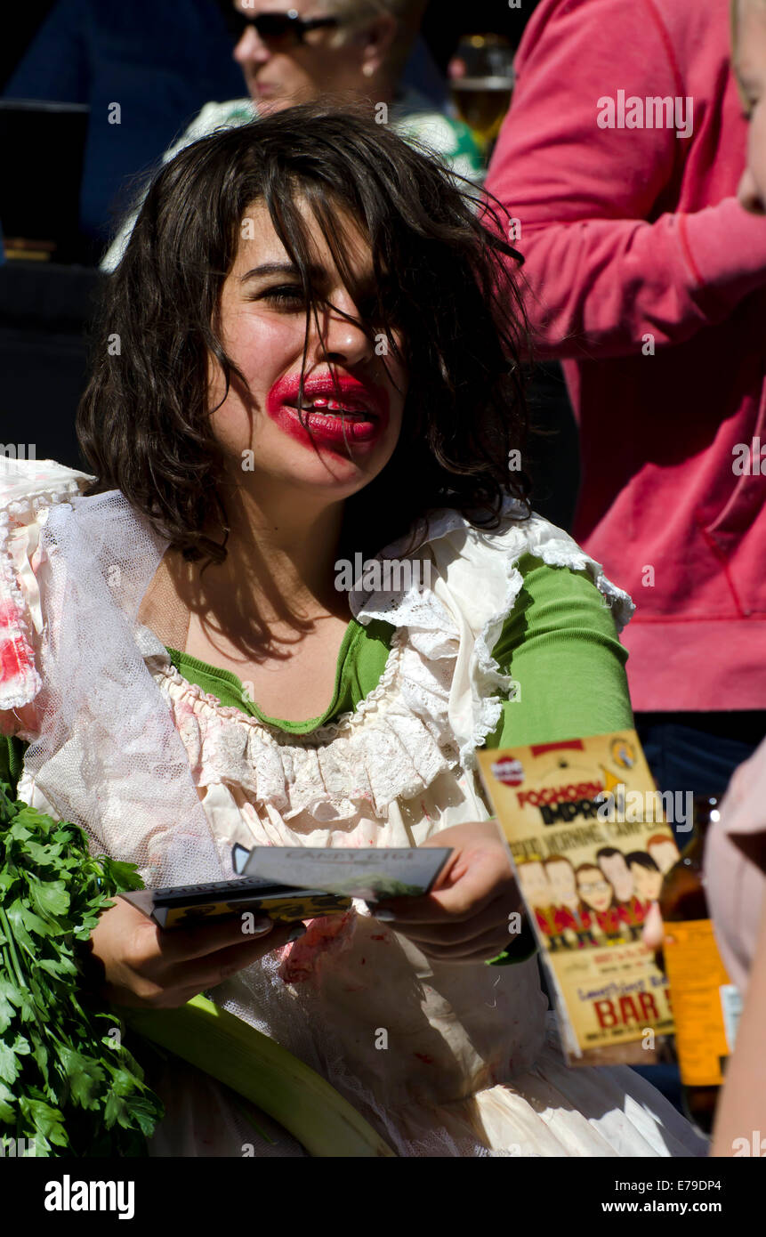 Woman with messy lipstick promoting a show at the annual Festival