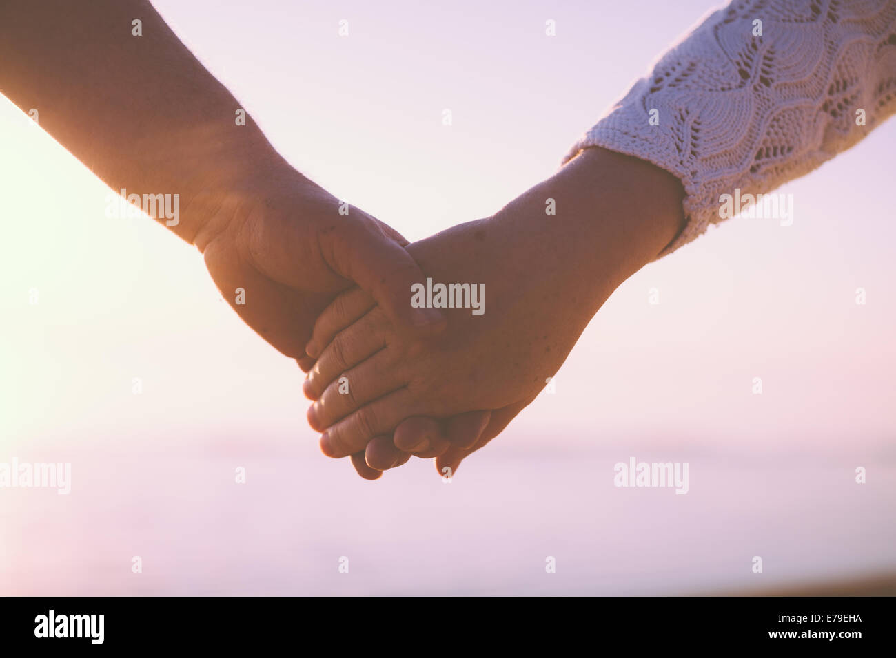 Senior couple holding hands Stock Photo