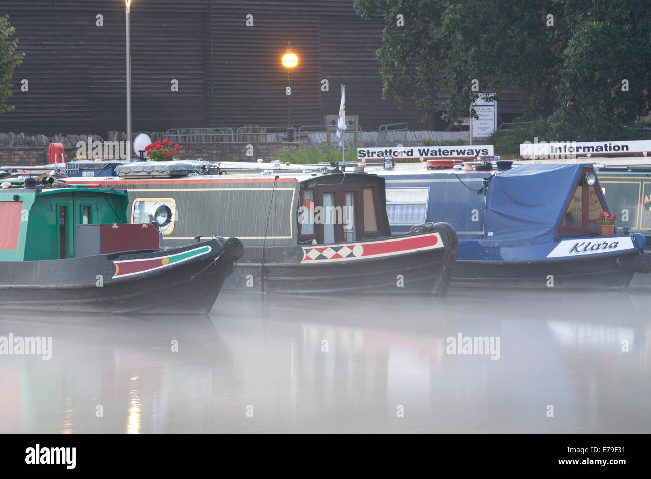 Narrowboats at dawn, misty, Stratford-upon-Avon, UK Stock Photo
