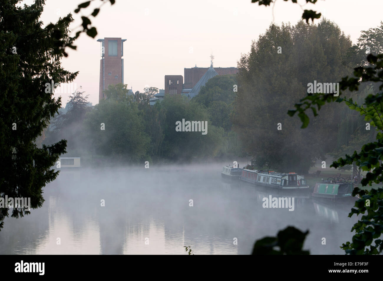 RSC theatre and River Avon, misty at dawn, Stratford-upon-Avon, UK Stock Photo