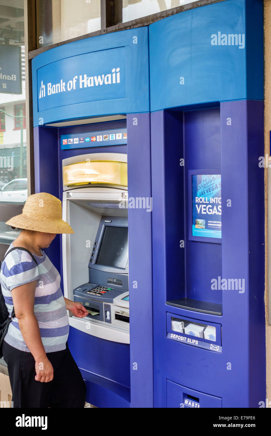 Hawaii,Hawaiian,Oahu,Honolulu,Chinatown,Bank of Hawaii,ATM,self-service,Asian woman female women,using,banking,USA,US,United,States,America Polynesia, Stock Photo