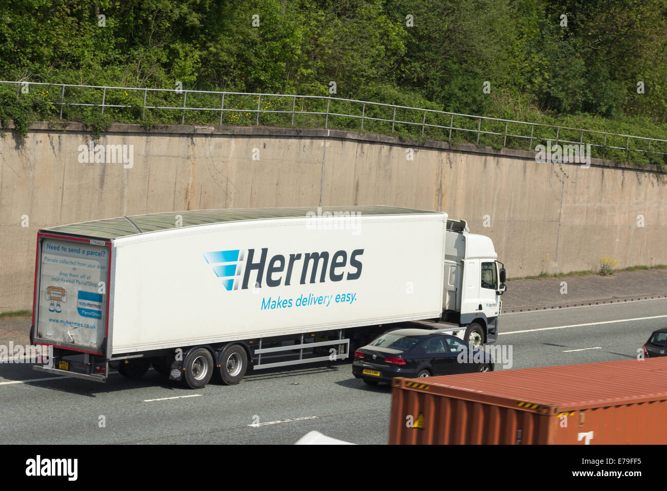 MyHermes parcel delivery courier articulated lorry travelling east on the four lane section of the M60 near Prestwich. Stock Photo