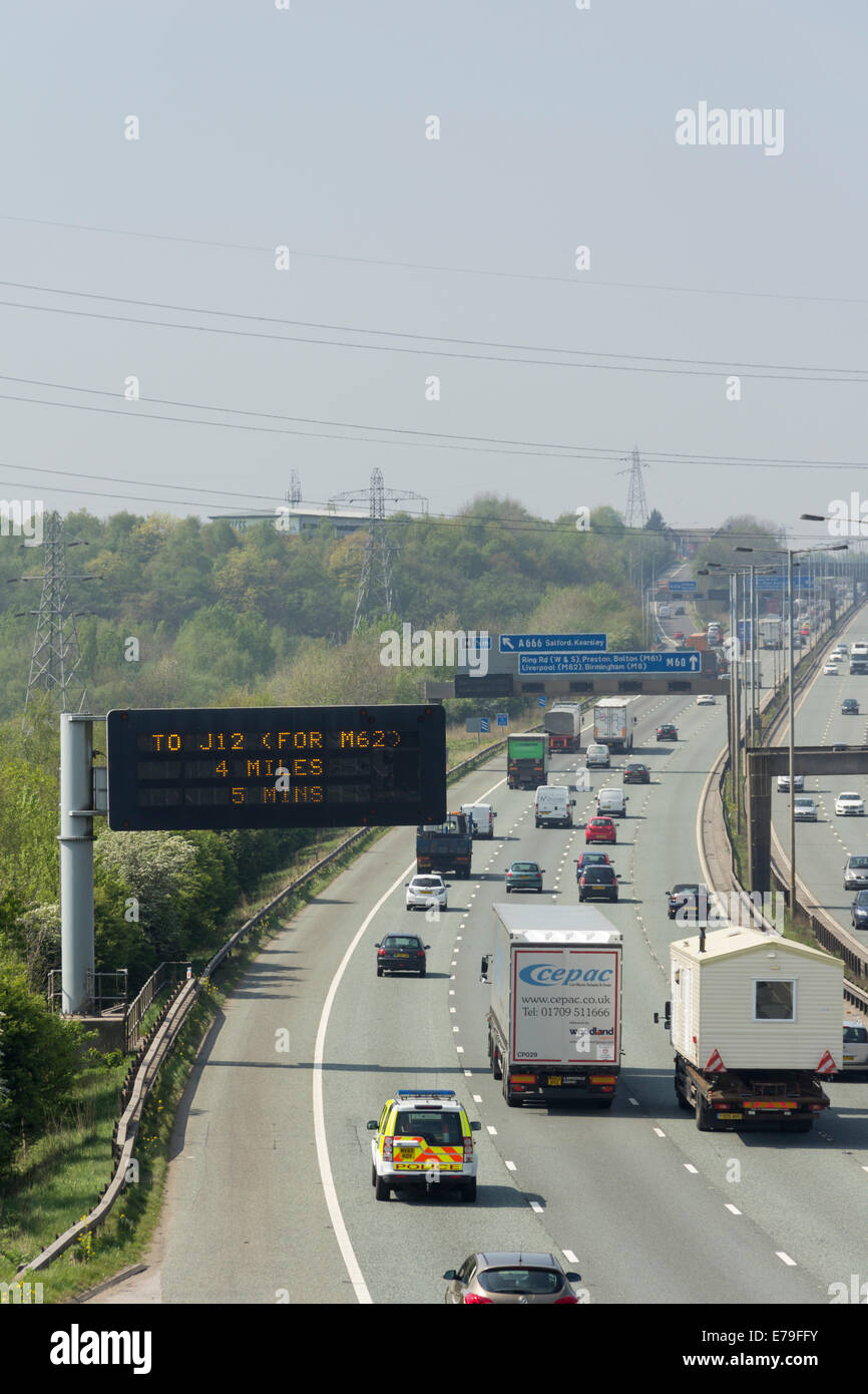 Traffic on the four lane section of the M60 motorway near Prestwich, Manchester, looking westbound over the Irwell valley. Stock Photo