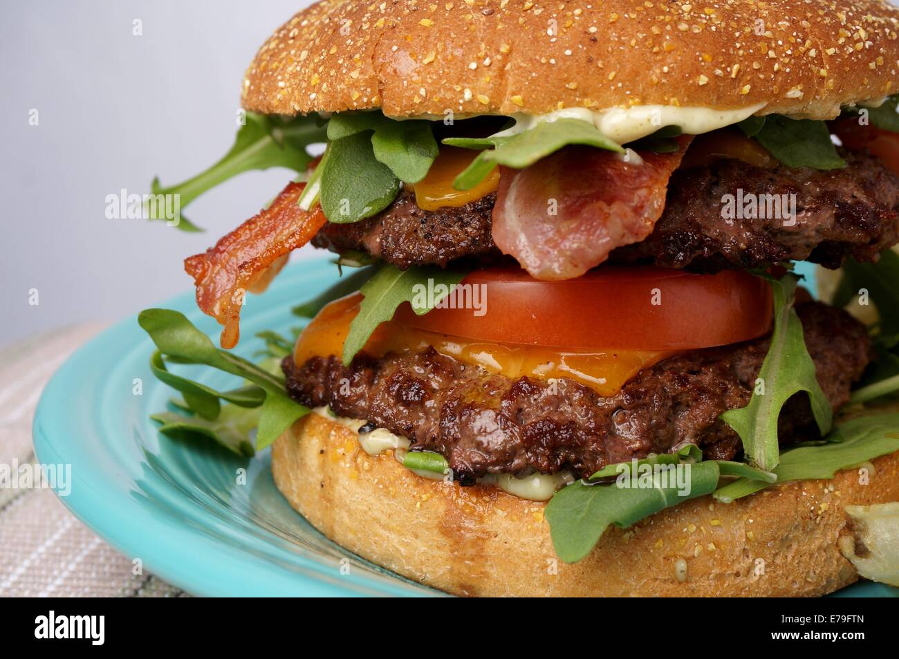 Juicy big bacon and cheese burger meal Stock Photo - Alamy