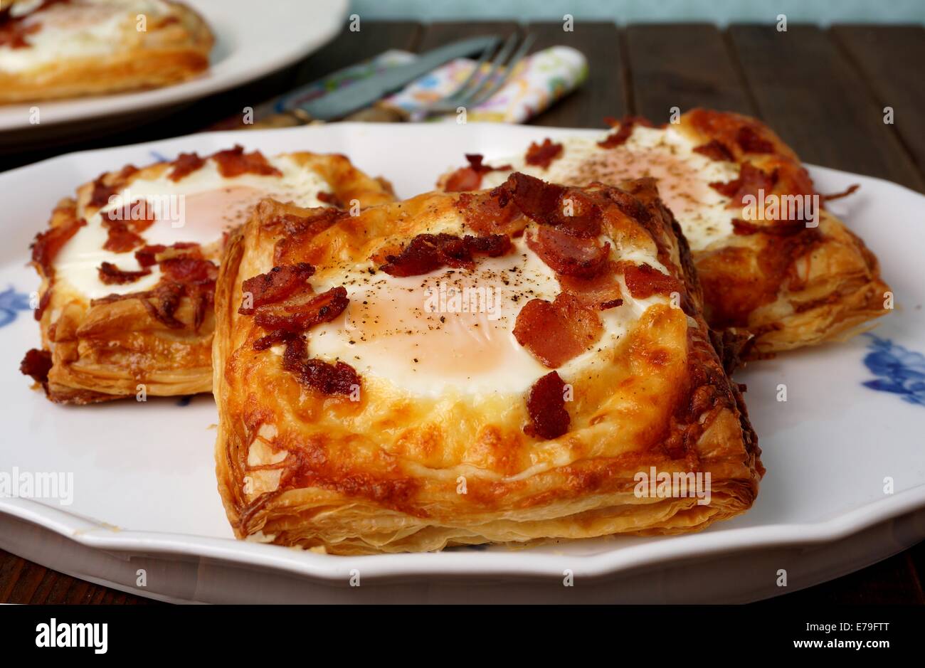 Puff pastry breakfast - egg, bacon and cheese Stock Photo - Alamy