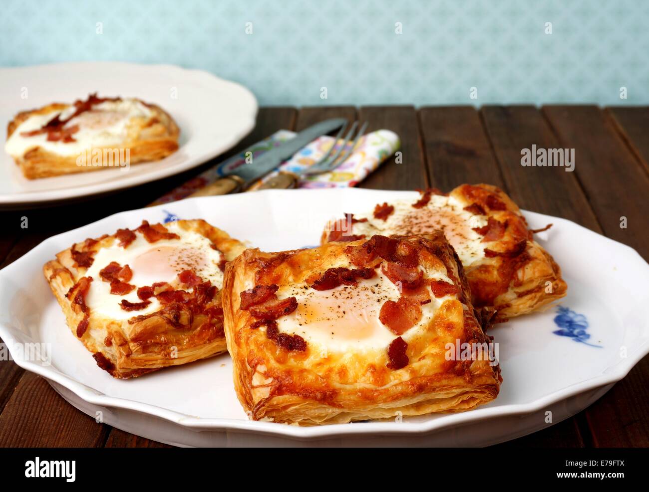 Puff pastry breakfast - egg, bacon and cheese Stock Photo - Alamy